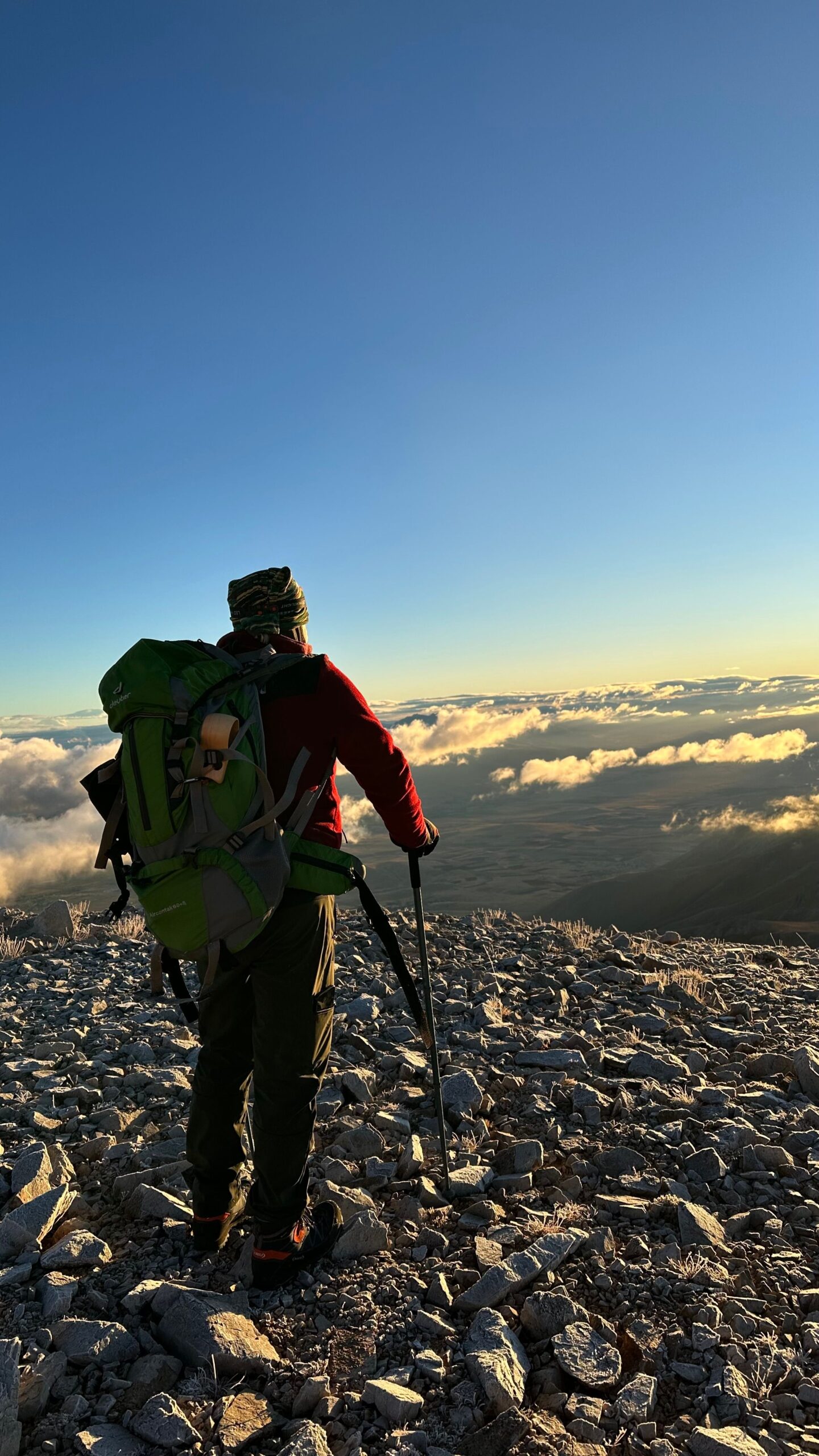 our-services-03 Lone hiker with backpack enjoys breathtaking mountain view at sunrise in Van, Türkiye.